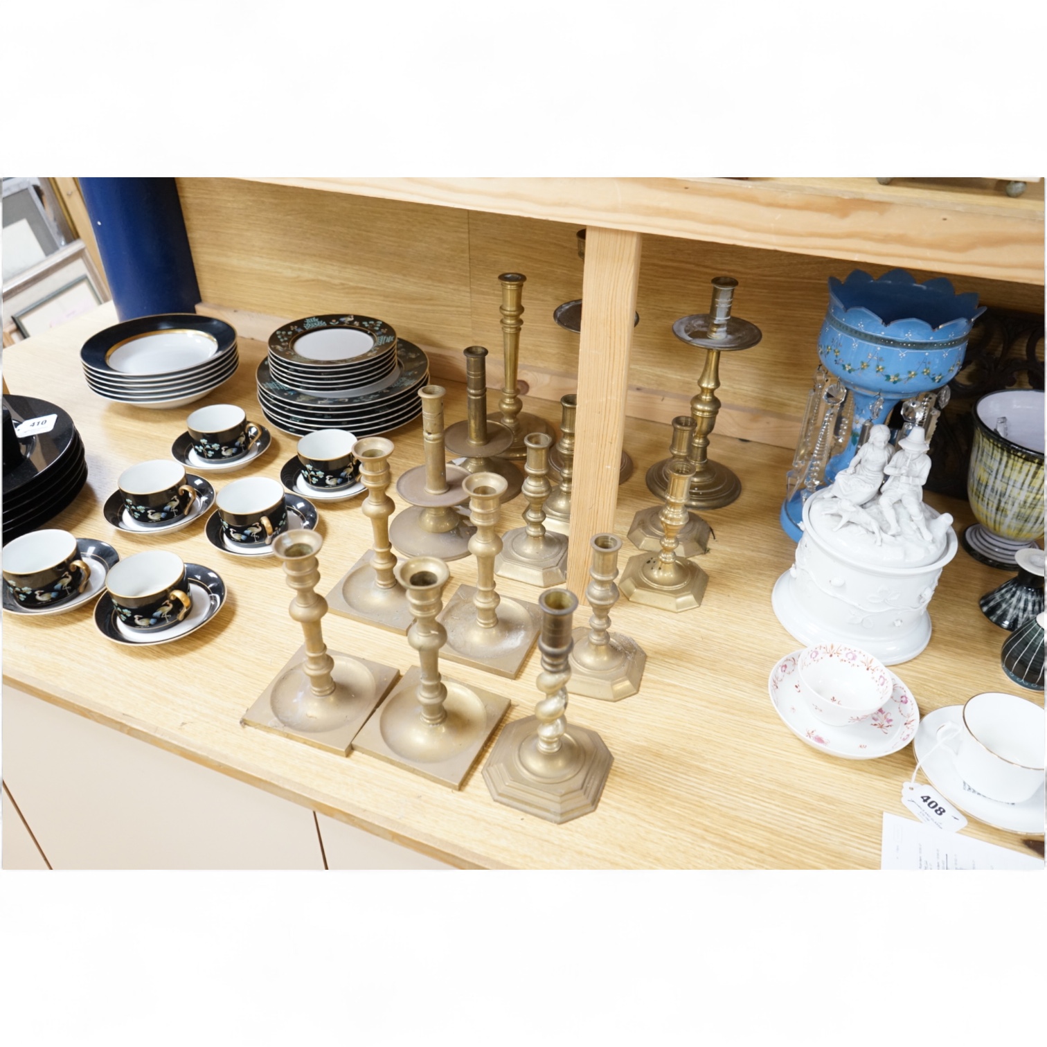 A collection of 19th century and later brass candlesticks, largest 33cm high